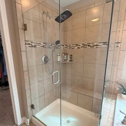Tiled walk-in shower with the glass door left streak-free